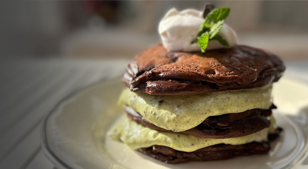 Thin Mint dark chocolate pancakes with mint custard, whipped cream and thin mint cookies