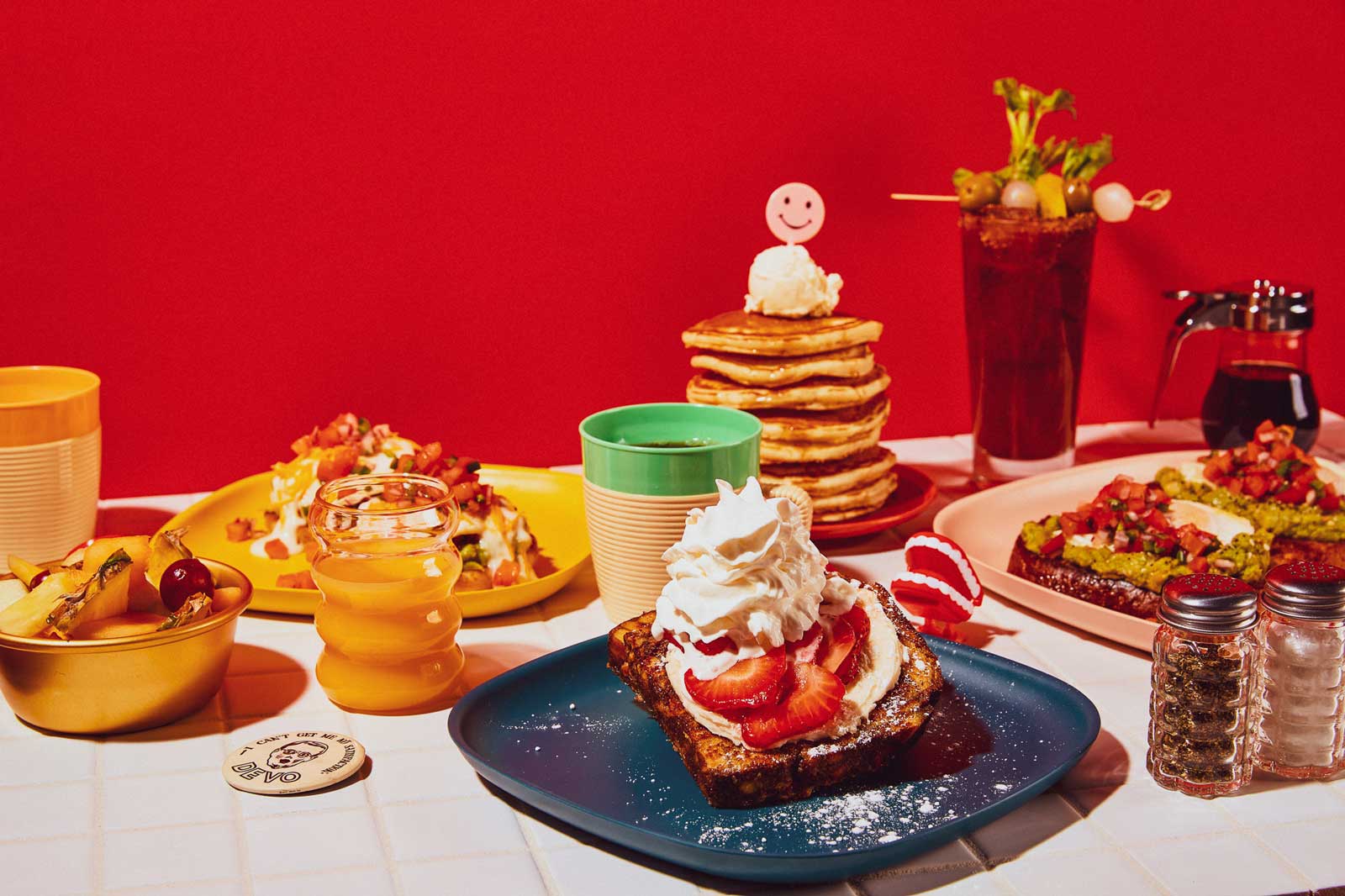 HangOverEasy Brunch, photo showing fun stack of pancakes, waffles, drinks and more